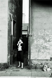 Judith in alleyway to apartment